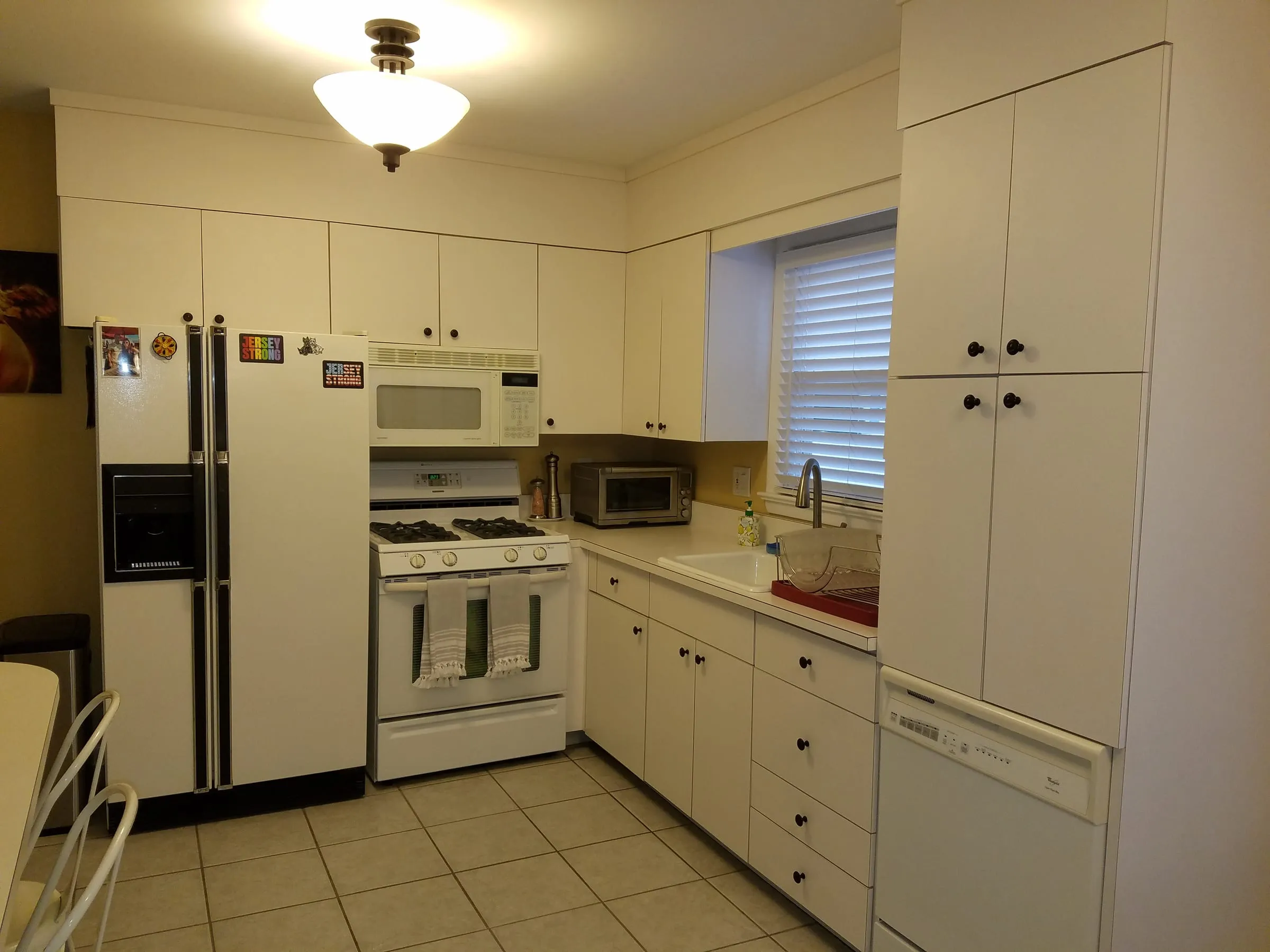 Before: 1990s laminate to a brass farmhouse kitchen