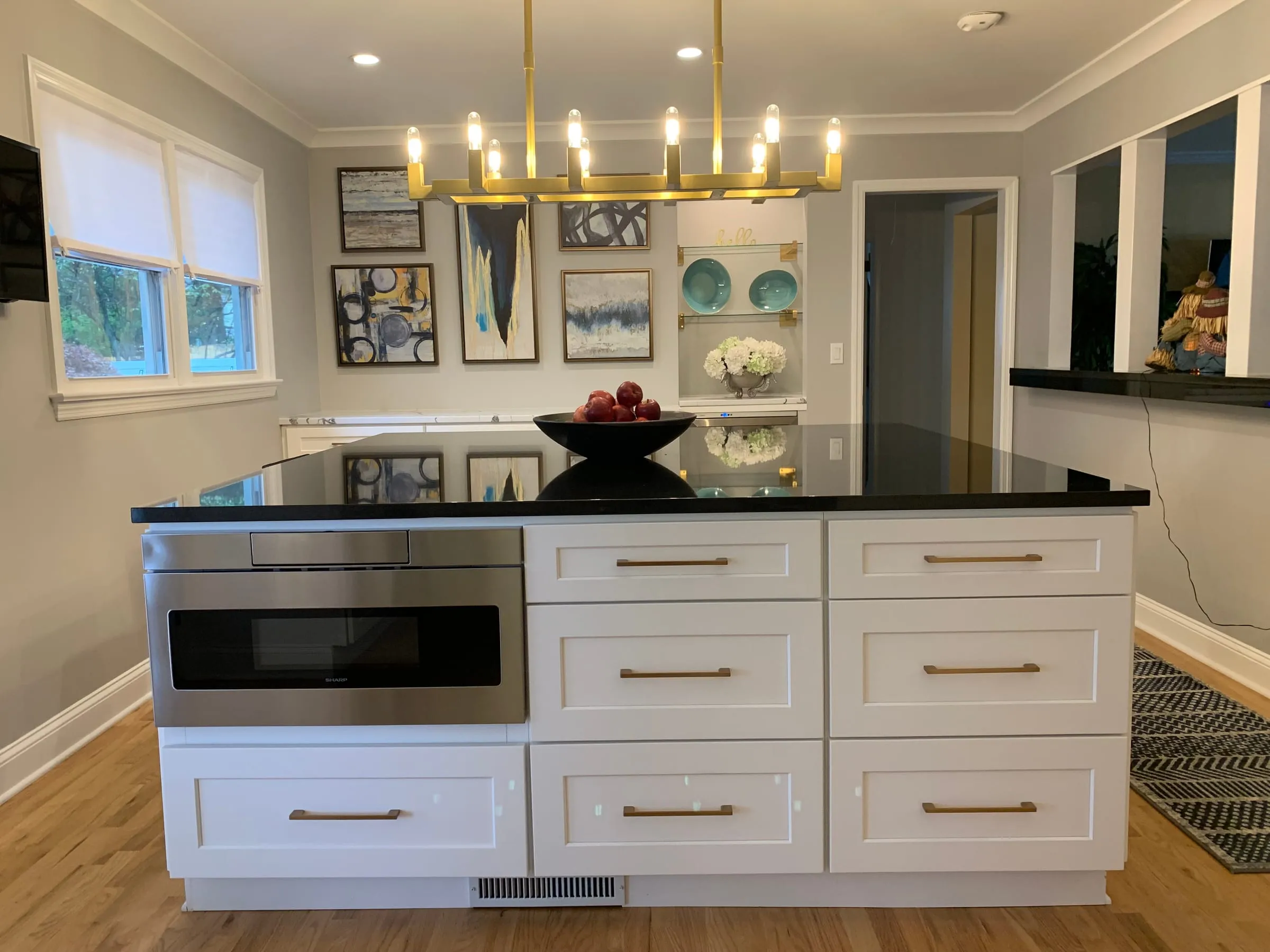 Black counters and a brass chandelier
