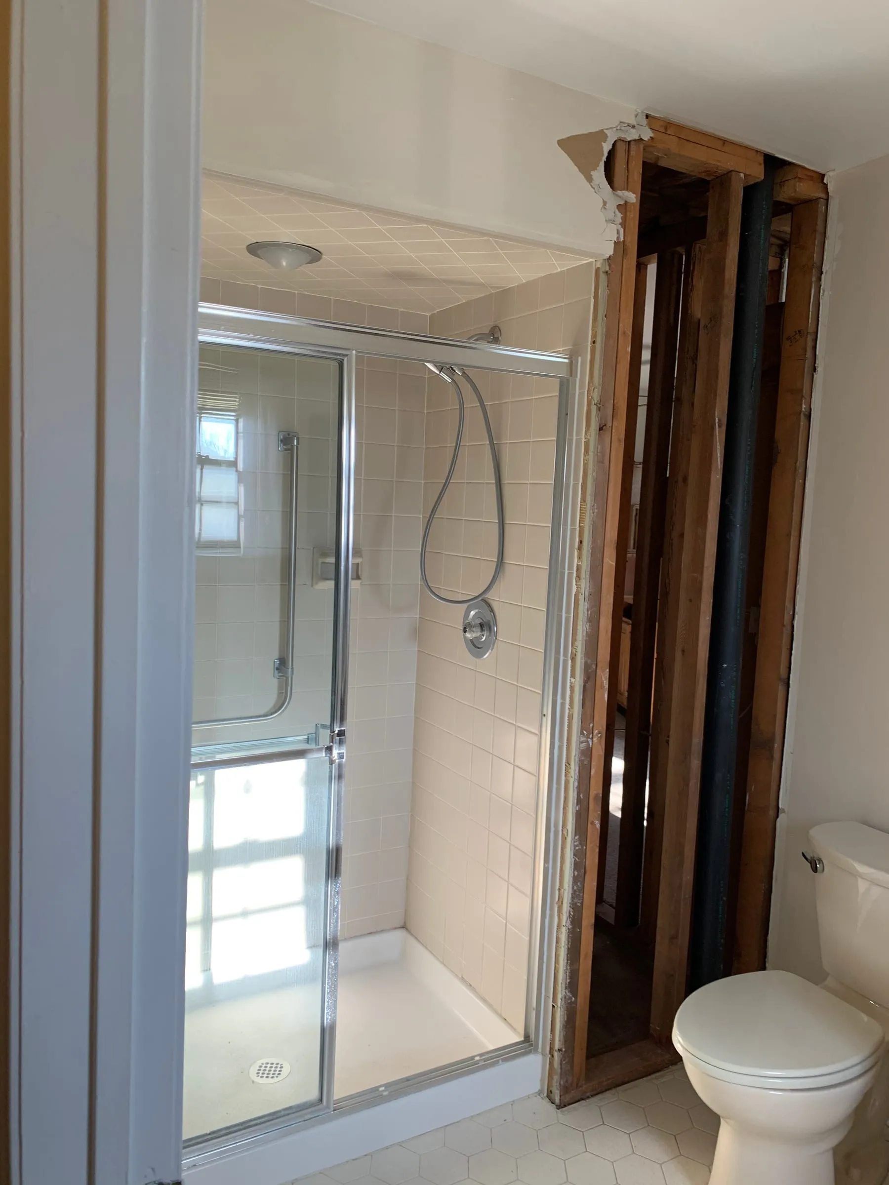 Before: A tired shower to marble and glass